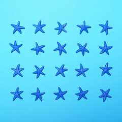 Small blue stars pattern on blue background