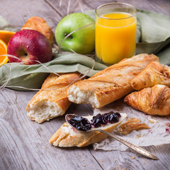 French baguette with butter and jam for breakfast