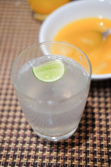 Close-up glass of iced lime soda drink