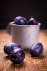 blue plums in cup