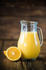 Obraz na płótnie Canvas fresh orange juice in pincher