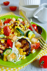 Salad with corn, tomatoes, eggplant and grilled croutons 