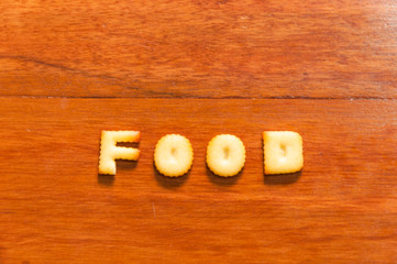 the word food written with cracker