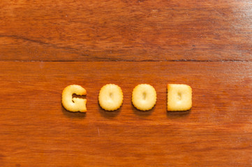 the word good written with cracker