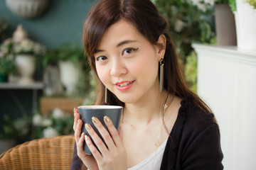 Portrait of thai adult women office beautiful girl drinking coffee
