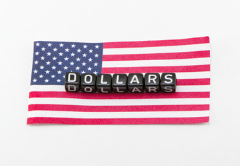 Word of dollars concept on the background of the flag