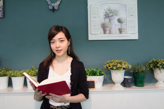 Portrait of thai adult women office beautiful girl reading book