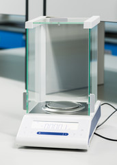 laboratory scale on white table © kwanchaichaiudom