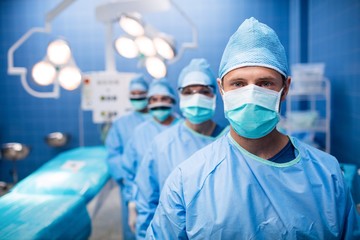 Portrait of surgeons standing in operation room