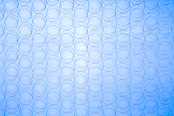 Plastic protective packaging background of blue bubbles