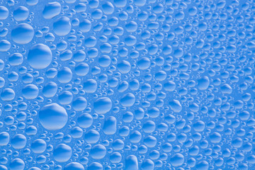 Drops different size which have frozen on glass