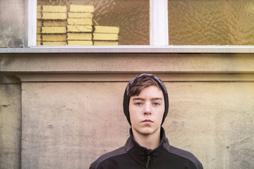 teenage boy with cap and books