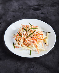 Coleslaw salad on white plate