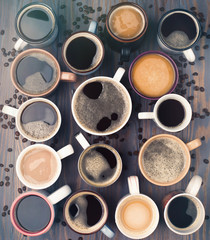 Many cups of coffee on wooden background, top view. Ideas communication corporate concept. Top...