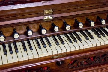 Close-up of antique reed organ harmonium