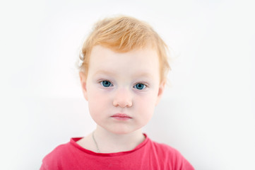 Naklejka premium The redhead child just awake