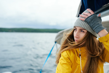 Young woman sailing the boat