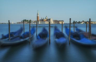 Venice gondolas with church in background