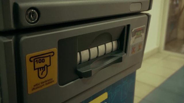 Woman Getting Money from ATM 50 plz.