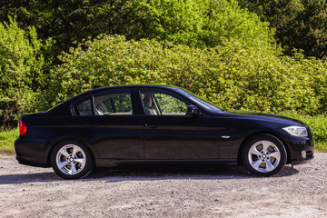 Side view BMW sedan - obrazy, fototapety, plakaty