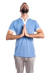 Fototapeta premium Man with blue shirt in zen position