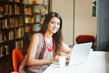 Indian woman works on laptop