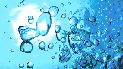 海底から見上げた空気の泡と太陽輝く水面　沖縄慶良間諸島 