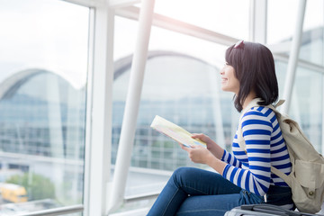  woman take map and smile