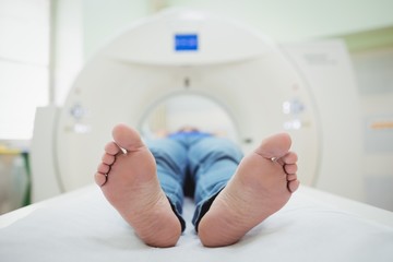 A patient is loaded into an mri machine