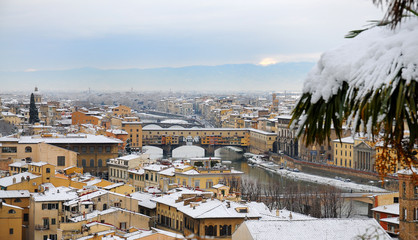 Ponte Vecchio or Old Bridge Florence Italy with snow panorama Tuscany, view from Piazzale...