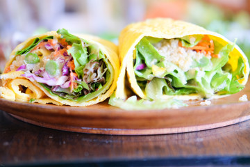 Omelette rolls with salad, cut in half