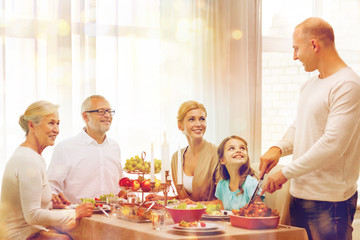 smiling family having holiday dinner at home