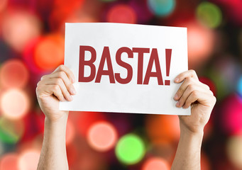 Enough! or Stop it! (in Spanish) placard with bokeh background