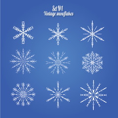 Fototapeta na wymiar Set 9 white different snowflakes of handmade with long shadow