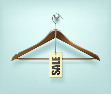 Clothes Coat Wooden Hanger with Sale Tag Label on Background