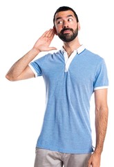 Fototapeta premium Man with blue shirt listening something
