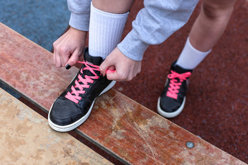 
Young woman in the city getting ready for a run 

