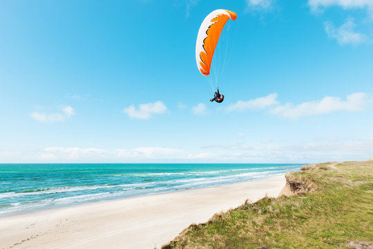 Paragliding on the deserted beach