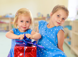 Two sisters with a gift