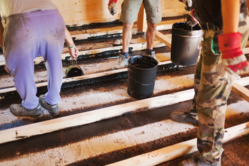 Workers installing a house foundation