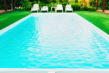Lounge chairs and pool