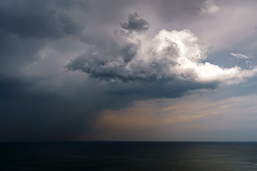 Fototapeta na wymiar rain and stormy cloud over sea