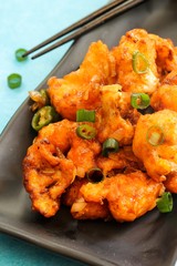 Gobi Manchurian - Indo chinese appetizer using cauliflower florets, selective focus