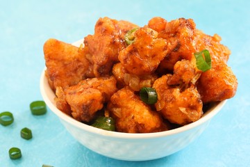 Gobi Manchurian - Indo chinese appetizer using cauliflower florets, selective focus