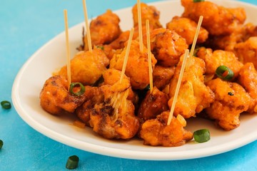 Gobi Manchurian - Indo chinese appetizer using cauliflower florets, selective focus
