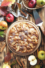 Homemade apple cake on brown wooden table