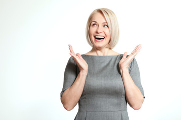 Surprised woman over white background. Human face expression, emotions, feeling attitude reaction