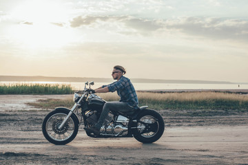 Plakat man riding motorcycle