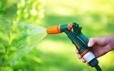 Watering garden with hose sprayer gun nozzle
