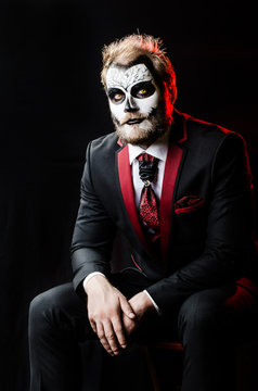 Dead face make up portrait of young man in studio.